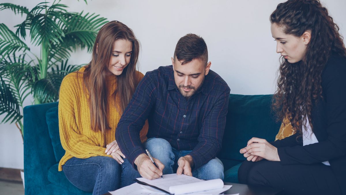A young adult in a financial coaching session going through a plan with an advisor